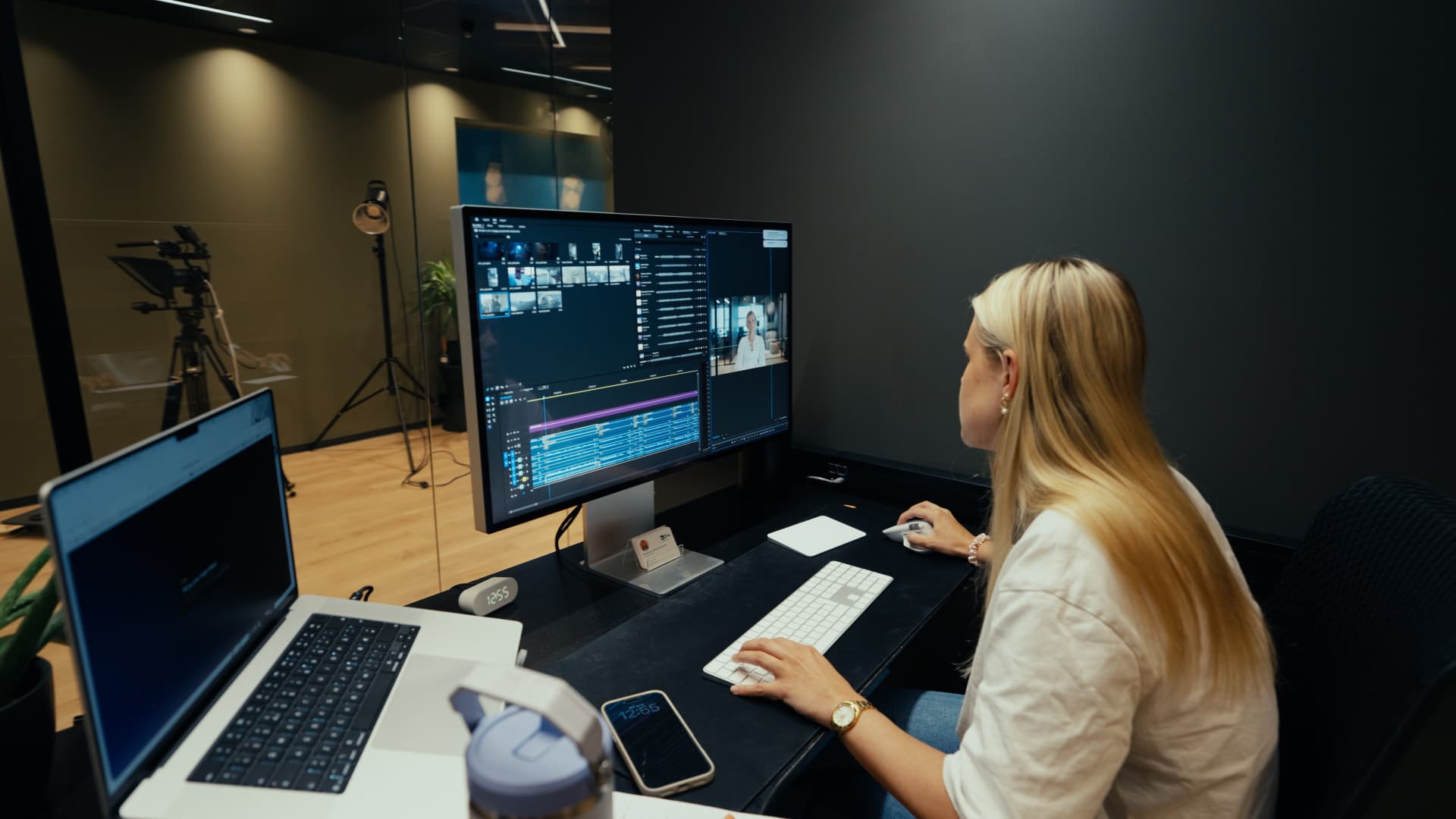 A Driv content producer editing video at the edit desk